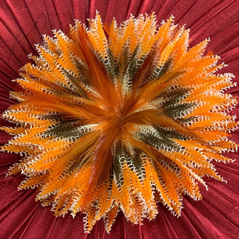 Orange floral pin with magnetic closure